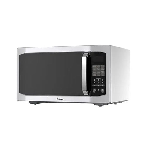 Stainless steel microwave oven on a white background