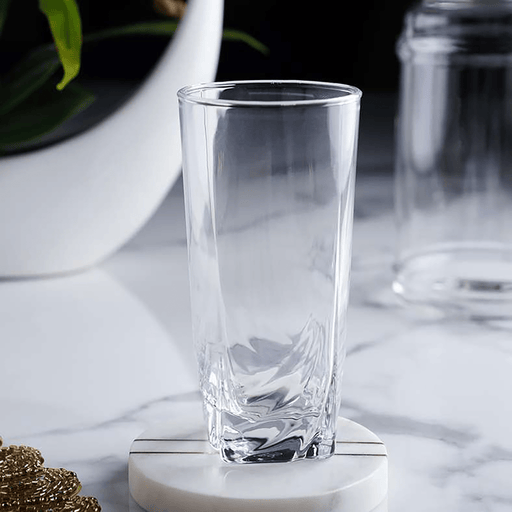 Clear glass on a marble surface with a blurred background
