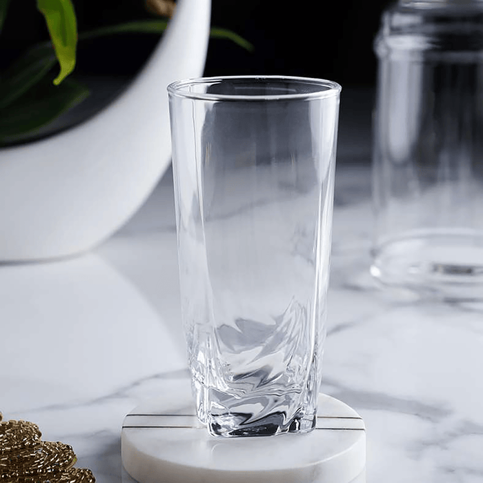 Clear glass on a marble surface with a blurred background
