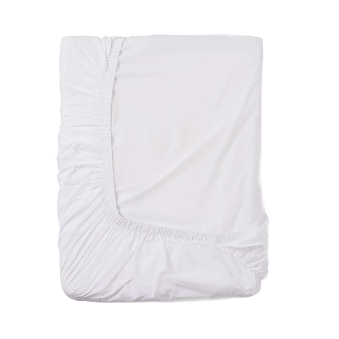 White fitted sheet on a green background