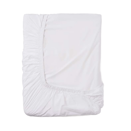 White fitted sheet on a green background