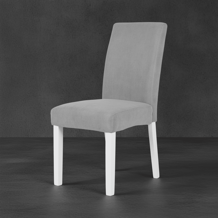 Gray upholstered chair with white legs on a dark background