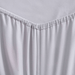 Close-up of a light gray fitted sheet on a bed with a plain background