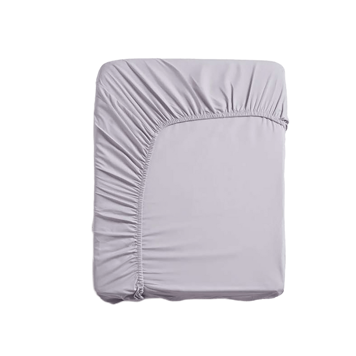 Light purple fitted sheet on a green background