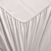 Close-up of a light gray fitted sheet on a bed