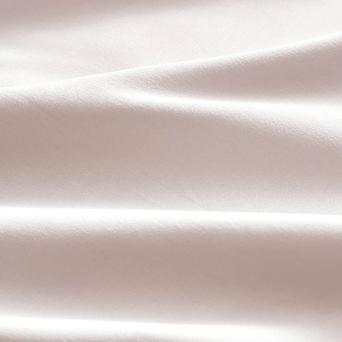 Close-up of a textured beige fabric surface