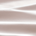 Close-up of a textured beige fabric surface