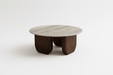 Modern coffee table with wooden legs and a light wood top on a white background
