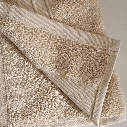 Close-up of a beige towel with textured surface