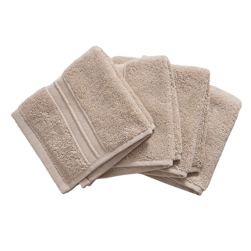 Set of beige towels on a white background