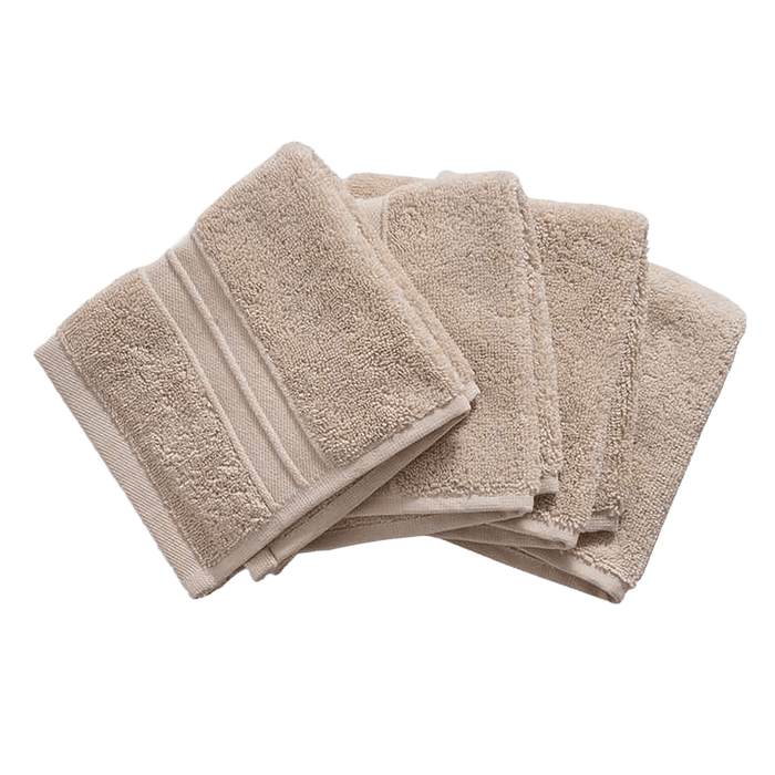 Set of beige towels on a white background