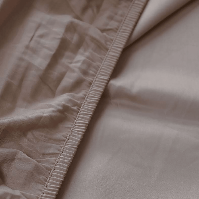 Close-up of beige fabric with stitching detail