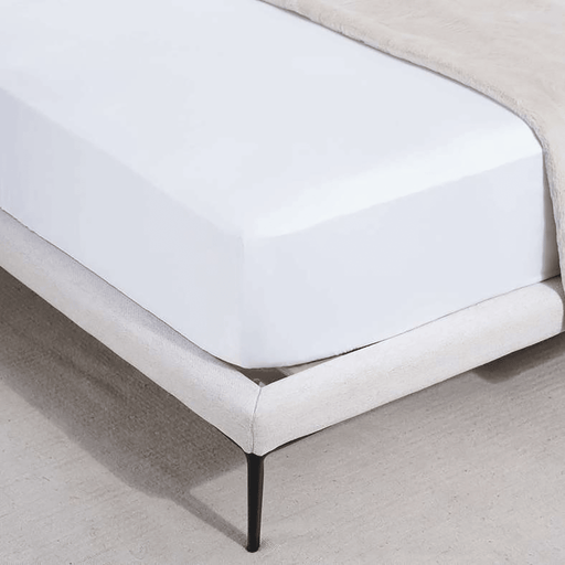 White fitted sheet on a bed with a neutral-colored headboard.