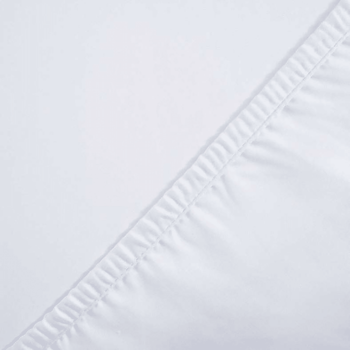 Close-up of a white fabric with a subtle pattern