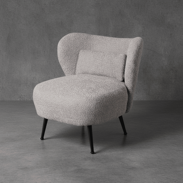 Gray textured armchair against a gray concrete wall
