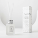 Fragrance diffuser with packaging on a white background