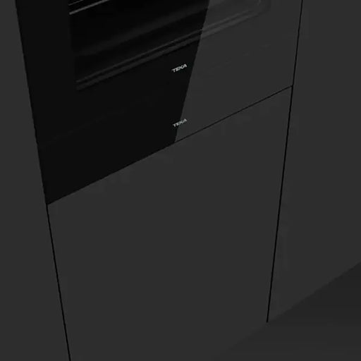 Close-up of a black kitchen appliance with Teka branding.
