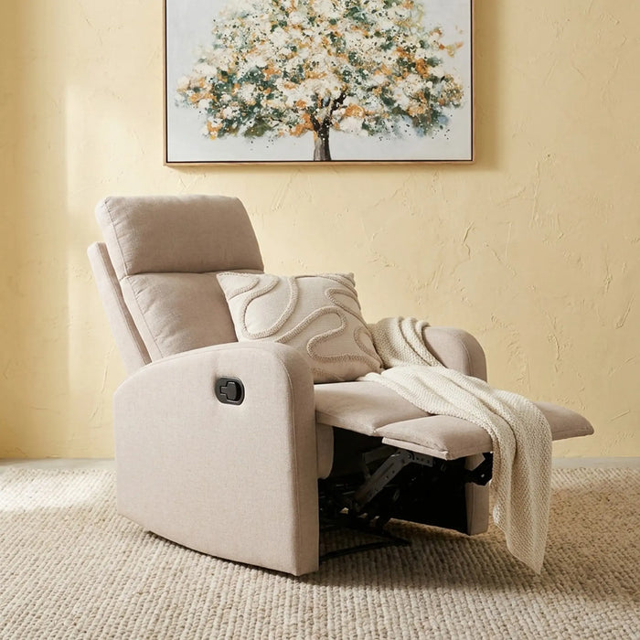 A beige upholstered recliner chair with the footrest extended, styled with a matching accent pillow and a cream throw blanket. The chair is set on a textured beige rug against a warm yellow wall, with a framed tree painting hanging above.