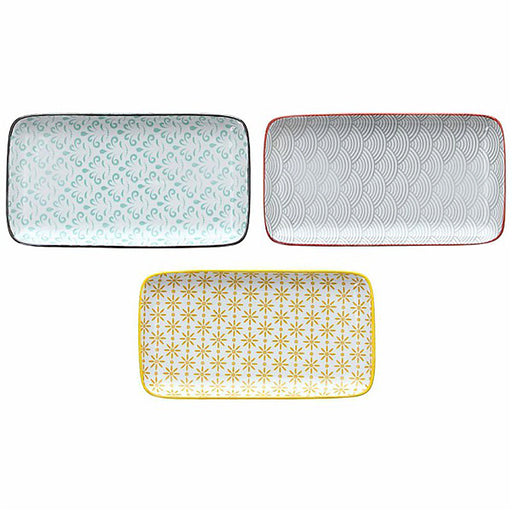 Three rectangular ceramic trays with different patterns on a white background