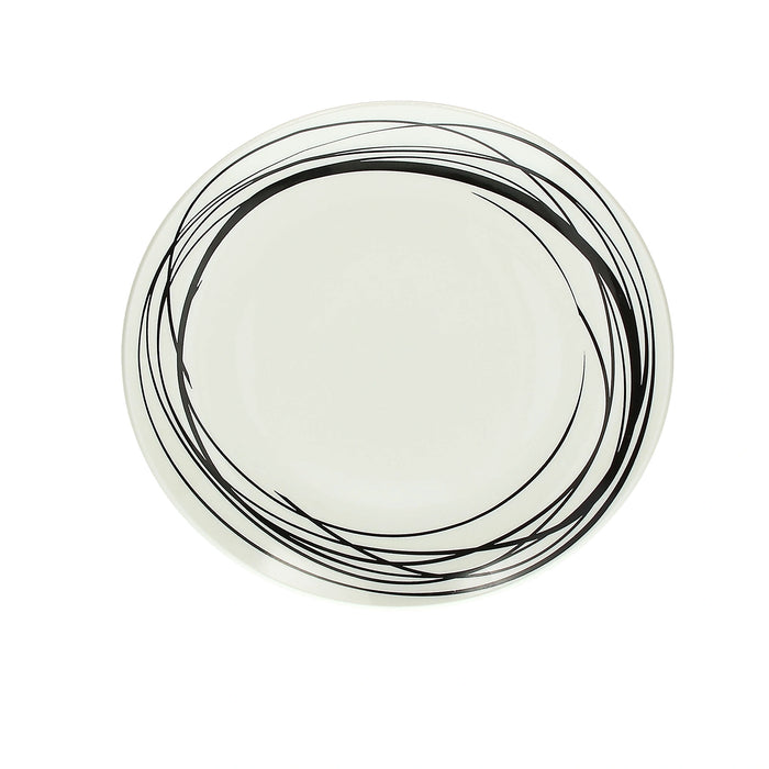 Round ceramic plate with black concentric circle design on a white background