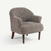 A single upholstered accent chair with a textured speckled fabric in gray, brown, and beige tones, featuring dark wooden turned legs, shown on a clean white background.