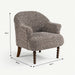 A small upholstered armchair with a textured speckled fabric in gray, beige, and brown tones, shown with dimension arrows and labels indicating 86 cm height, 80 cm width, and 76 cm depth on a light gray background.