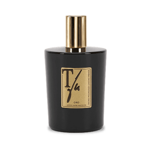 Black perfume bottle with gold cap and label on a white background