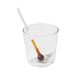 Clear glass with a white straw and a small brown object inside on a green background