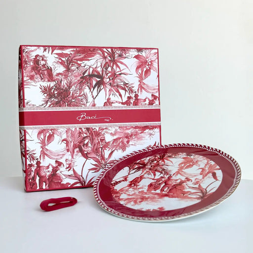 Red and white floral-patterned box and plate on a white background
