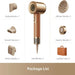 Gold hair dryer with various nozzles and a leather case on a beige background