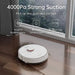 Robotic vacuum cleaner cleaning a wooden floor with text highlighting its features.