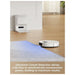 Robotic vacuum cleaner on a carpet with text about ultrasonic carpet detection.