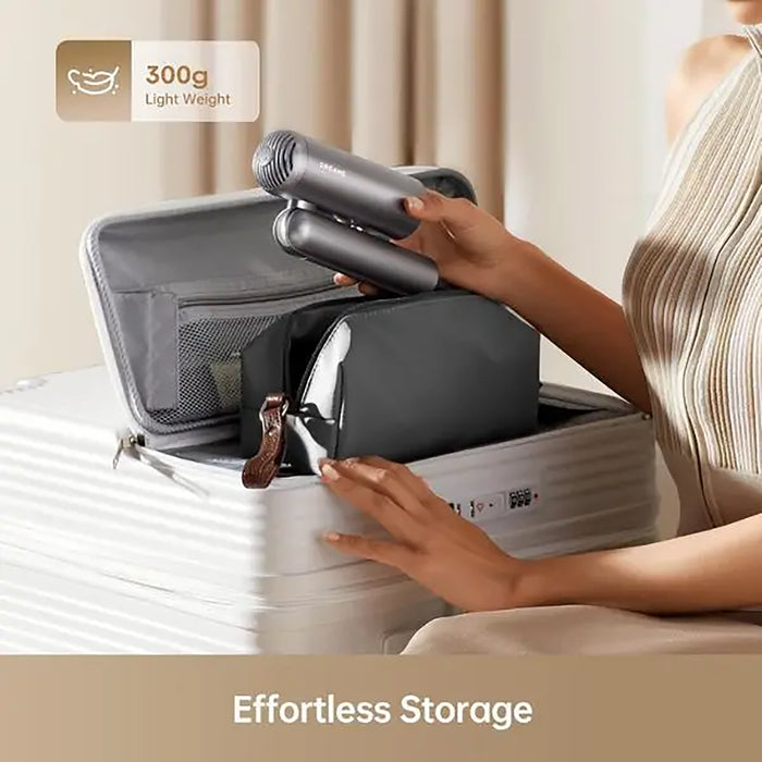 Person organizing travel items into a compact bag with a hair dryer inside, labeled '300g Lightweight'.