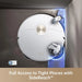 Robotic vacuum cleaner with SideReach feature on a dark surface