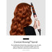 Person with red hair using a Conical Airwrap barrel on a white background