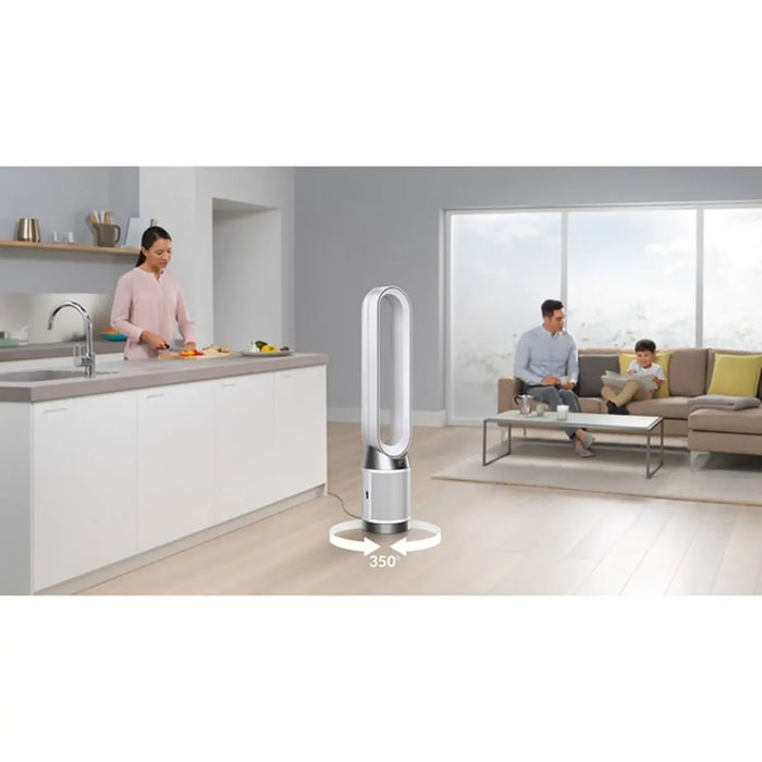 Modern kitchen and living room with a Dyson tower fan in the foreground.