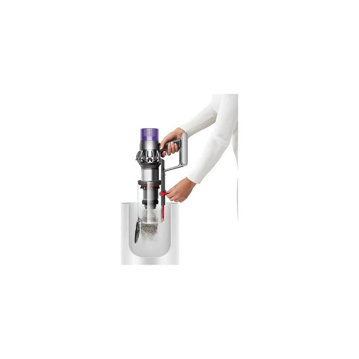 Person using a handheld vacuum cleaner on a white background
