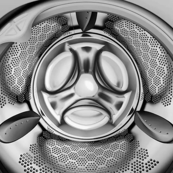 Close-up of a washing machine drum with a brand logo.