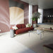 Modern living room with a red sofa, glass coffee table, and decorative elements.