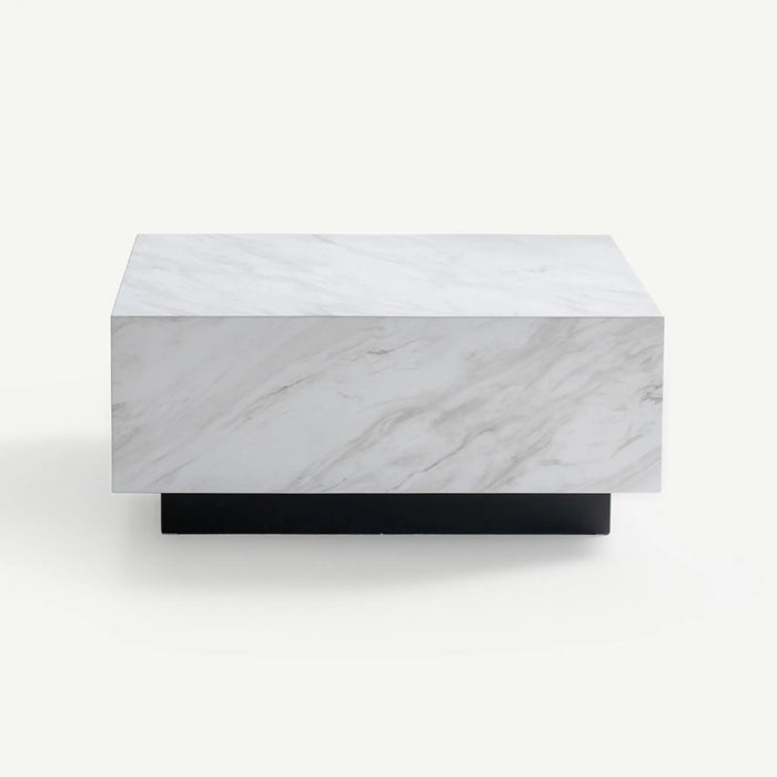 A modern rectangular coffee table with a white marble top featuring gray veining and a solid black metal base, shown against a plain off-white background.