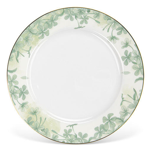 White plate with green floral pattern on a white background