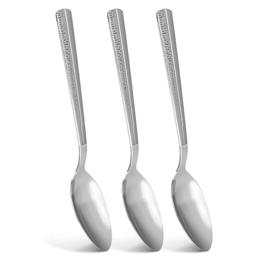 Three silver spoons with decorative handles on a white background