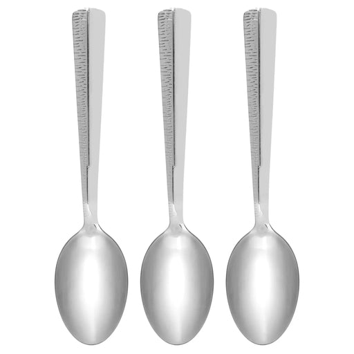 Three silver spoons with textured handles on a white background