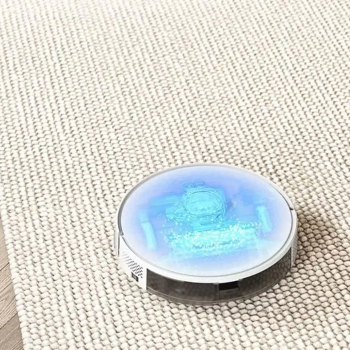 Round device with glowing blue light on a textured surface