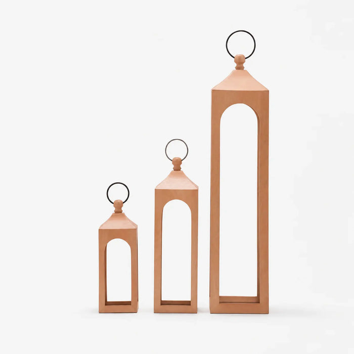 Three wooden lanterns of different sizes on a white background