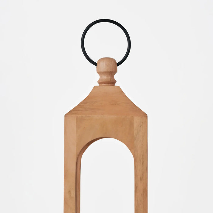 Wooden doorstop with a black rubber ring on a white background