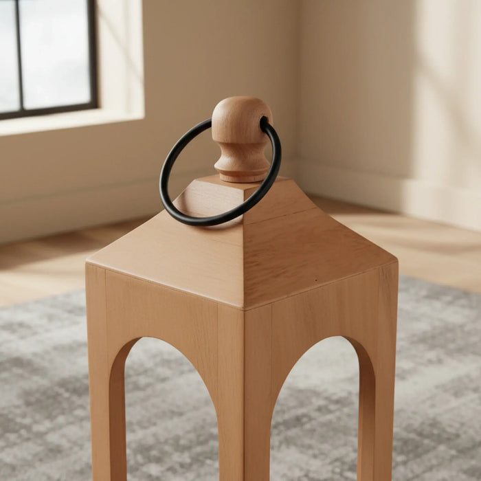 Wooden stool with a black ring on top in a room with a window and rug.