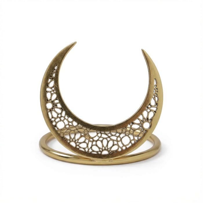 Gold crescent moon-shaped decorative item on a white background