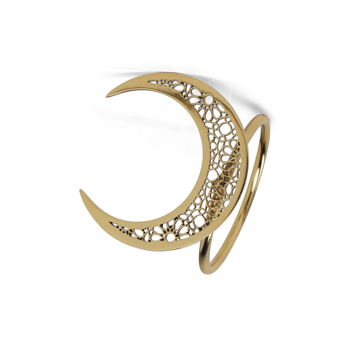 Gold crescent moon-shaped brooch with intricate design on a white background