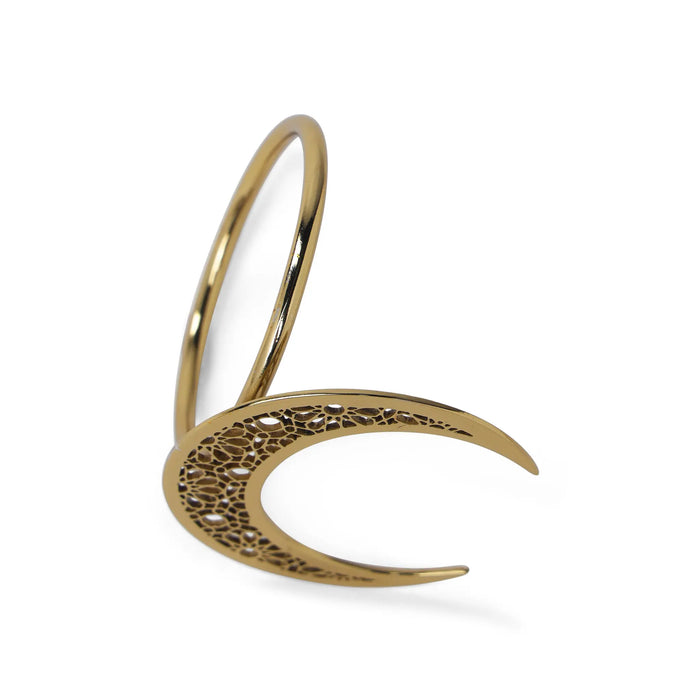 Gold bracelet with intricate design on a white background